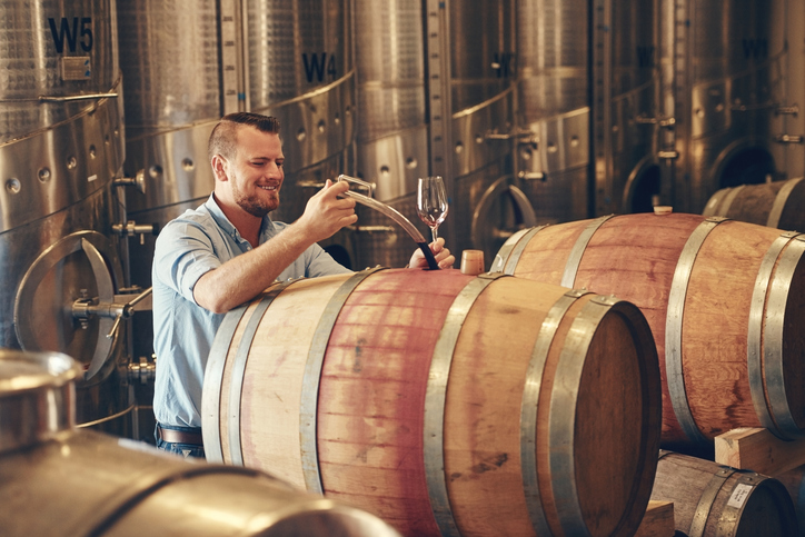 Winemaker pouring wine