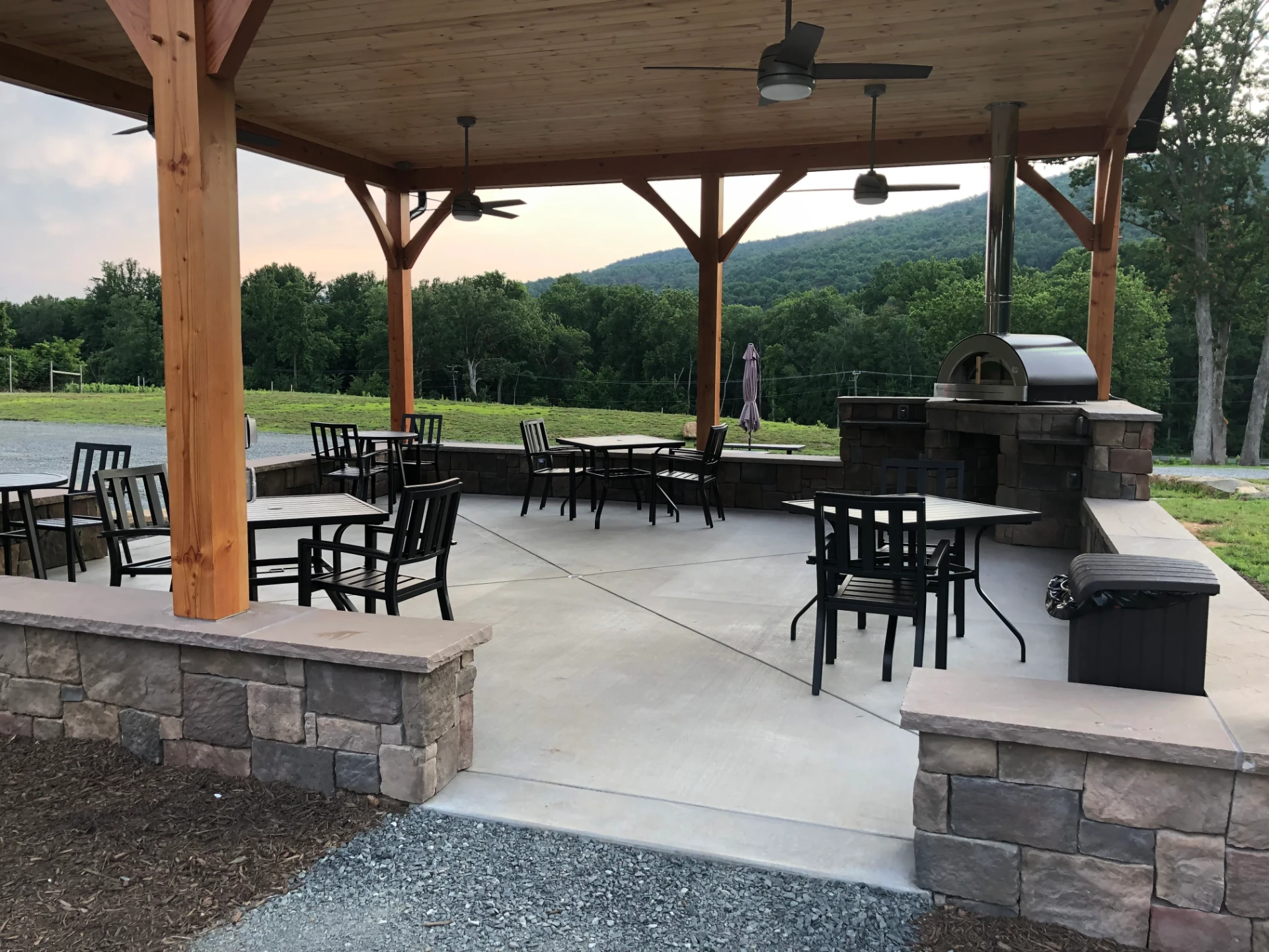 Covered outdoor pavilion at Bozzo Family Vineyards with a wood-fired pizza oven and mountain views